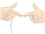 Two hands demonstrating proper flossing technique between teeth.